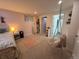 Charming bedroom featuring a unique hanging chair and multiple points of entry including one to the bathroom at 5255 S Waco St, Centennial, CO 80015