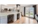 Cozy dining area with a breakfast bar, white cabinetry, and French doors to the backyard at 5255 S Waco St, Centennial, CO 80015