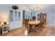 Elegant dining room featuring wooden table, chairs, and abundant natural light at 5255 S Waco St, Centennial, CO 80015