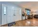 Spacious entryway with wood floors and natural light flowing into the living area at 5255 S Waco St, Centennial, CO 80015