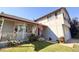 Inviting home showcasing a lovely front porch, American flag decor, and attached garage on a sunny day at 5255 S Waco St, Centennial, CO 80015