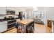 Modern kitchen with stainless steel appliances and a large island at 5255 S Waco St, Centennial, CO 80015