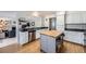 Open concept kitchen with stainless steel appliances and ample counter space at 5255 S Waco St, Centennial, CO 80015
