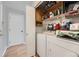 Functional laundry room equipped with washer, dryer, and shelving for storage at 5255 S Waco St, Centennial, CO 80015