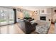 Inviting living room with a brick fireplace, french doors, and comfortable seating at 5255 S Waco St, Centennial, CO 80015