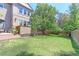 Large backyard with lush green grass and a wooden fence at 14307 Waterside Ln, Broomfield, CO 80023