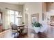 Bright dining area with hardwood floors and a round table with chairs at 14307 Waterside Ln, Broomfield, CO 80023