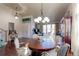 Open concept dining room with hardwood floors and a large chandelier at 14307 Waterside Ln, Broomfield, CO 80023