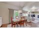 Bright dining area with hardwood floors and charming wooden table and chairs at 14307 Waterside Ln, Broomfield, CO 80023