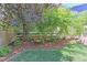 Landscaped garden with seating area and lush greenery at 14307 Waterside Ln, Broomfield, CO 80023