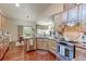 Spacious kitchen with ample cabinetry, stainless steel appliances, and hardwood floors at 14307 Waterside Ln, Broomfield, CO 80023