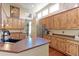 Modern kitchen with an island, stainless steel appliances, and wood cabinets at 14307 Waterside Ln, Broomfield, CO 80023