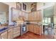 Modern kitchen featuring wood cabinets, stainless steel appliances, and granite countertops at 14307 Waterside Ln, Broomfield, CO 80023