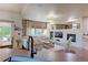 Spacious living room with a modern fireplace and built-in shelving at 14307 Waterside Ln, Broomfield, CO 80023