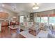 Open living room showcasing a cozy sectional sofa, fireplace, and large windows at 14307 Waterside Ln, Broomfield, CO 80023