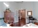 Bright home office features built-in shelving and hardwood floors at 14307 Waterside Ln, Broomfield, CO 80023