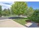 Quiet street with tree-lined sidewalks and park views at 14307 Waterside Ln, Broomfield, CO 80023