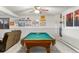 Finished basement featuring a pool table, wainscotting, and recessed lighting at 8571 W 71St Cir, Arvada, CO 80004