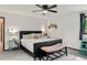 Bedroom with black furniture, soft carpet, and ample natural light at 8571 W 71St Cir, Arvada, CO 80004