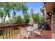 Outdoor deck with patio furniture, a grill, and overhead shade for outdoor dining and relaxation at 8571 W 71St Cir, Arvada, CO 80004