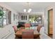 Well-lit dining room featuring a wooden table, large windows, and ample natural light at 8571 W 71St Cir, Arvada, CO 80004