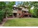 Back of home featuring patio, deck, and backyard at 8571 W 71St Cir, Arvada, CO 80004