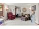 Cozy living room with neutral carpet, a large window, and comfortable seating at 8571 W 71St Cir, Arvada, CO 80004
