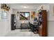 Well-lit office space with desk, chair, shelving and natural light from the window at 8571 W 71St Cir, Arvada, CO 80004