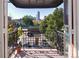Balcony view offering a glimpse of the city skyline amidst lush greenery, perfect for outdoor enjoyment at 836 E 17Th Ave # 2B, Denver, CO 80218