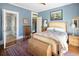 A cozy bedroom with hardwood floors and a decorative rug, offering a relaxing retreat at 836 E 17Th Ave # 2B, Denver, CO 80218