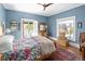 Bright bedroom with hardwood floors, ceiling fan, balcony and plenty of natural light for a comfortable space at 836 E 17Th Ave # 2B, Denver, CO 80218