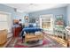 Bright bedroom with blue accents, wooden floors, unique rugs and furniture, creating a tranquil retreat at 836 E 17Th Ave # 2B, Denver, CO 80218