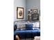 Stylish bedroom showcasing blue walls, coordinated linens, and decorative artwork, creating a soothing ambiance at 836 E 17Th Ave # 2B, Denver, CO 80218