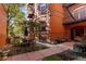Charming courtyard with brick pavers, seating area, and a manicured garden at 836 E 17Th Ave # 2B, Denver, CO 80218