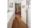 View from kitchen to the dining room with hardwood floors and traditional furnishings at 836 E 17Th Ave # 2B, Denver, CO 80218