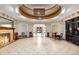 Grand foyer with an intricate tile mosaic, elegant woodwork, fireplace, and impressive architecture at 836 E 17Th Ave # 2B, Denver, CO 80218