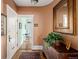 Inviting hallway with hardwood floors, decorative mirror, and access to other rooms at 836 E 17Th Ave # 2B, Denver, CO 80218