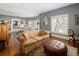 Inviting living room with neutral tones, hardwood floors, and large windows for natural light at 836 E 17Th Ave # 2B, Denver, CO 80218