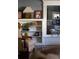 Living room featuring a built-in bookshelf, comfortable chair, and neutral decor at 836 E 17Th Ave # 2B, Denver, CO 80218