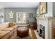 Living room featuring hardwood floors, a decorative fireplace, and an inviting, neutral color palette at 836 E 17Th Ave # 2B, Denver, CO 80218