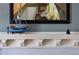 Close-up highlighting the mantel with a model ship and a painting at 836 E 17Th Ave # 2B, Denver, CO 80218
