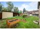 Landscaped backyard with plants, raised garden beds and plenty of green space at 1470 S Yates St, Denver, CO 80219