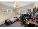 Bedroom with updated windows, ceiling fan and wood floors at 1470 S Yates St, Denver, CO 80219