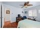Spacious bedroom features hardwood floors, large windows and closet at 1470 S Yates St, Denver, CO 80219