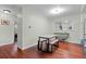 Cozy dining area with hardwood floors, natural light, and comfortable seating at 1470 S Yates St, Denver, CO 80219