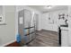 Kitchen area featuring stainless steel appliances and dark wood-style flooring at 1470 S Yates St, Denver, CO 80219