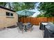 Patio with seating, table, and grill, perfect for outdoor entertaining at 1470 S Yates St, Denver, CO 80219