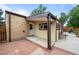 Back patio with outdoor seating, partial enclosure, and convenient access to the house at 1470 S Yates St, Denver, CO 80219