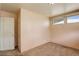 This bedroom features neutral walls, carpeted floors, and a door that leads to the rest of the home at 41 Cortez St, Denver, CO 80221