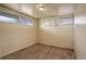 This room features neutral walls, carpeted floors, and two windows that provide natural light at 41 Cortez St, Denver, CO 80221